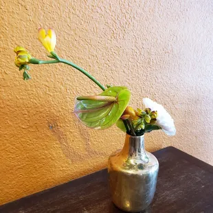 a vase of flowers on a table