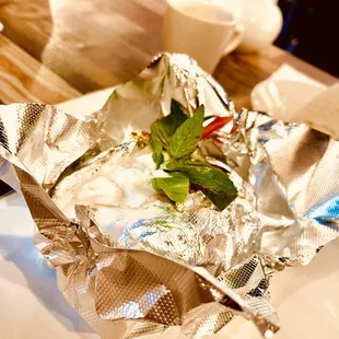 a wrap of food on a cutting board