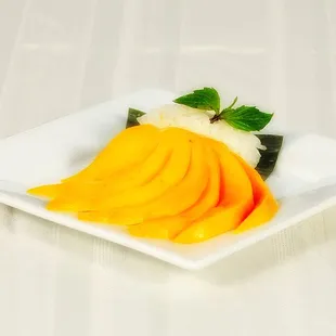 sliced mangoes on a white plate