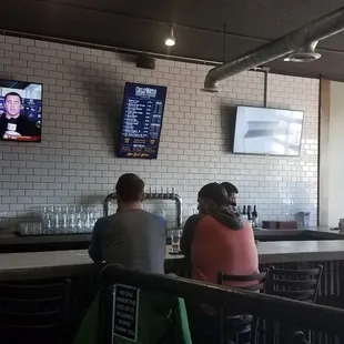 people sitting at the bar