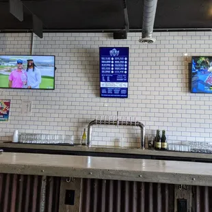 two televisions on the wall