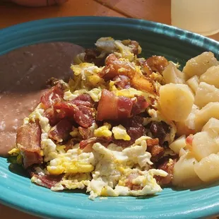 Their Mexican potatoes and refried beans were perfect breakfast plate companions... eggs and bacon mixed per our request.... perfection!