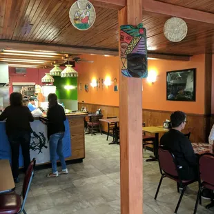 Open seating area plus an upstairs balcony