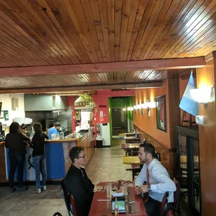 First floor of the restaurant. Great vibe with authentic artwork on the walls. You can order to go or dine in.