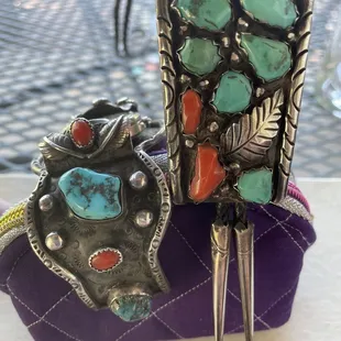 Watch band on the left was made by my father-in-law. Bolo on the right, was found at the store. Both done in the same type of style, Navajo.