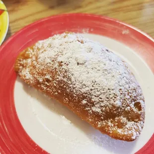 Empanada de Queso with powdered sugar