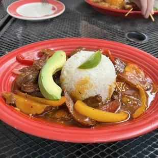 Saltado (flank steak) with rice and avocado