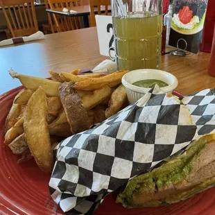 SÁNDUCHE DE PERNIL pork with and aji criollo on a &quot;plantain bun&quot; to make it gluten free.  Fresh cut fries mint limonade