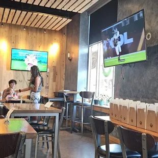 Multiple screens showing sports, anime, and kpop