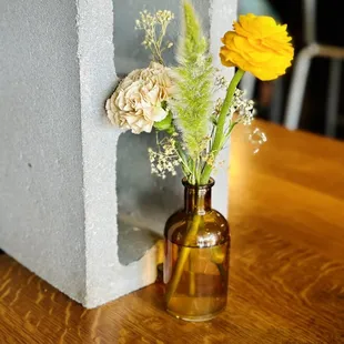 a vase with flowers in it on a table