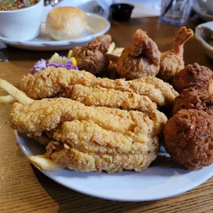 a plate of fried chicken and french fries
