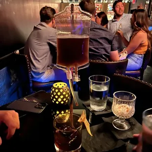 a group of people sitting at a bar