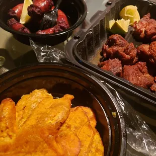 Sausage, fried pork chunks and tostones