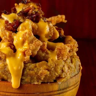 Boneless chicken bathed in cheese and bacon