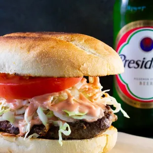 The Chimi its a toasted portugroll with cabbage, tomato and our home made patty goes along great with a cold one!