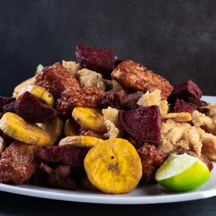 Looking for a great shareable app? Look no further order our sampler for 4 which comes with a variety of meats cheeses and plantains.