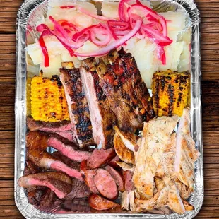 Our grilled BBQ platter is only available for takeout it has sausage, chicken, picahna, ribs and corn feeds 3