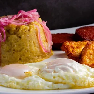 Traditional Dominican breakfast its called 3 strikes or 3 golpes. Eggs, salami and fried cheese with mangu