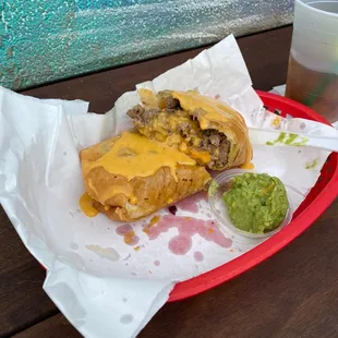 a sandwich with cheese and guacamole