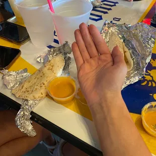 This is the chips and queso (hand for size reference). It was $4 and they did not include the chips