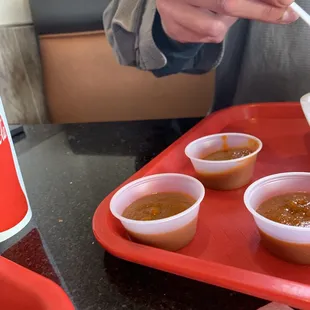 They charge for half a cup of hot sauce