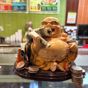 a statue of a laughing buddha