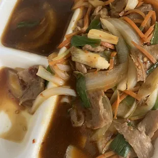 Mongolian beef uncooked and soaking in sauce