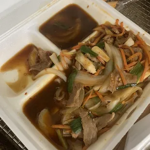 Uncooked Mongolian beef, soaking in sauce