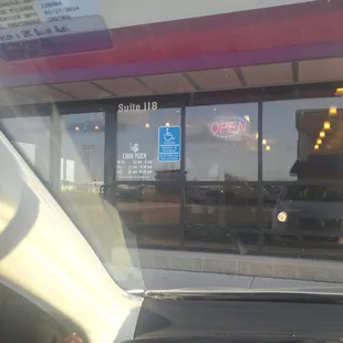 the reflection of a car in the window