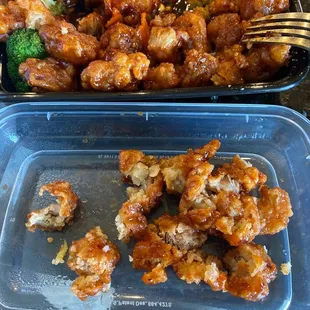 two plastic containers with food in them