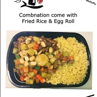 a plate of rice and vegetables with chopsticks