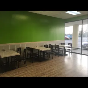 a restaurant with tables and chairs