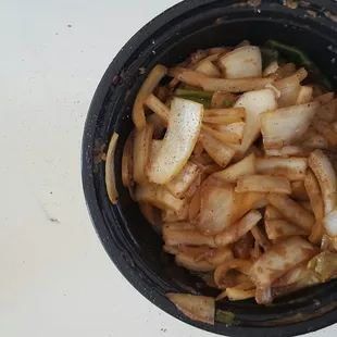 mongolian beef.. This is just a pic of ALL, NOTHING BUT ONIONS, call any place.. There should be some mixed veggies in this