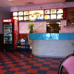 the inside of a restaurant with a checkered floor
