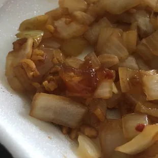 Some kind of weird brown rubbery goo, on the pile on onions that was more than my entree.