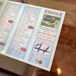 a menu on a glass table