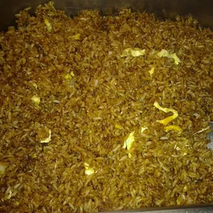 a dish of rice with a spoon