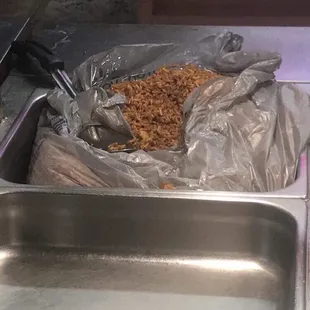 Fried rice scooped from Wal Mart bag for Togo orders. Yummy!