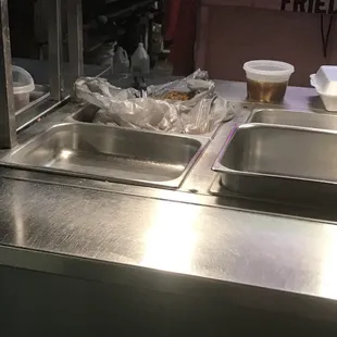 Rice stored in a grocery bag on buffet line