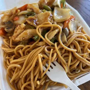 a plate of noodles and vegetables