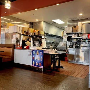 a restaurant with a large kitchen