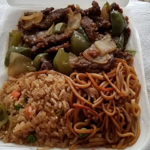 The lunch special featuring pepper steak with fried rice and chow mein noodles. The price is very close to $10.