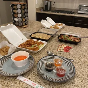 Lemon chicken, fried rice, pot stickers, and egg rolls.