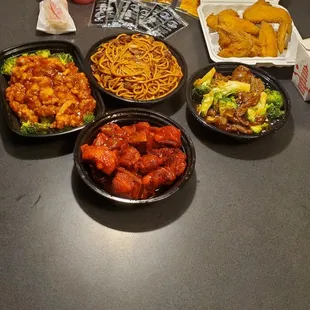 Broccoli beef, beef lo mein, orange chicken, spring rolls and rib tips