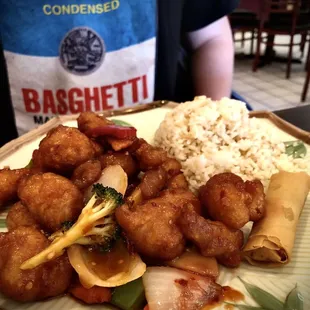 My son&apos;s Gen Tso lunch special that came with choice of soup and served next to fried rice and egg roll.