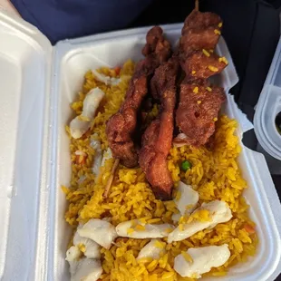 Chicken skewers and chicken fried rice