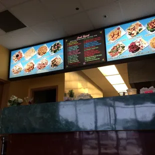 menus on the wall of a restaurant