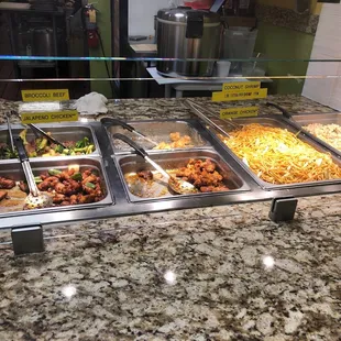 a variety of food items in a buffet