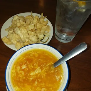 Delicious crunchy fried noodles appetizer and egg drop soup.
