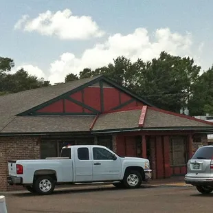cars parked in front of the restaurant